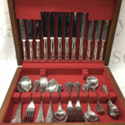 A canteen of Sheffield stainless steel cutlery . Postage catC