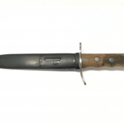 An Italian M.V.S.N fighting Knife , Taken from an Italian submarine 1943. blade Approx 21cm long. Total dagger length 32cm Approx. This lot cannot be posted
