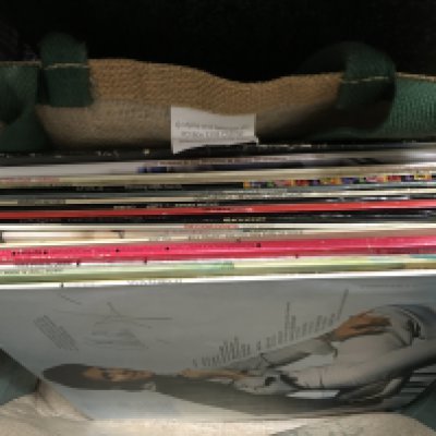 LPs and albums including David Bowie Pin Ups, Genesis Foxtrot, Beatles rock n roll music , John Lennon etc with player. No reserve