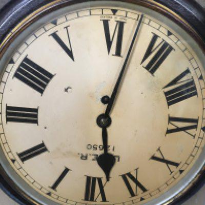 A station LNER mahogany wall clock , the dial with Roman numerals.