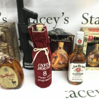 A collection of 7 bottles of various whiskey including Grants royal and dimple etc.