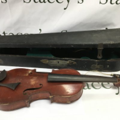 A 1930 cased violin in need of repair.