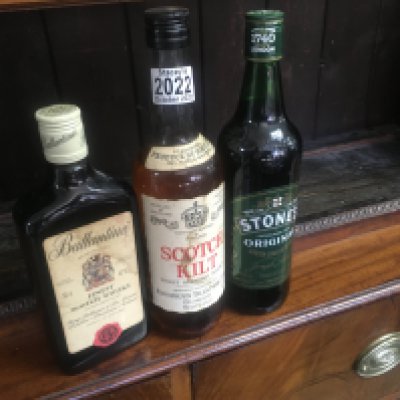 Three bottles of alcohol including scotch Kilt .
