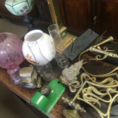 A Collection of oil lamps parts shades and funnels together with a pair of Art Nouveau style gas brackets.