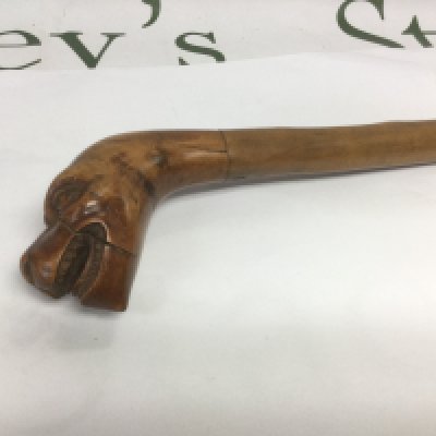 A walking cane, the handle in the form of the head of a mythical beast, approx total length 90cm. Shipping category D.- NO RESERVE