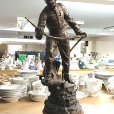 A French spelter figure of a fireman, marked Sauvee Par X Raphanel. 59cm tall.