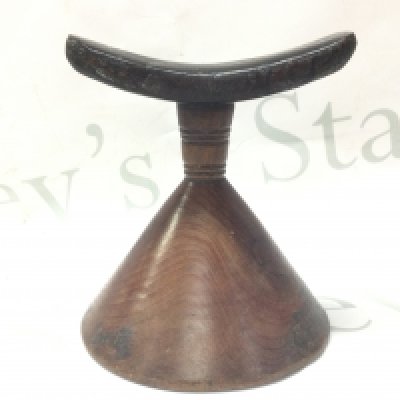 An Ethiopian wooden pillow. 14cm tall. Postage category B