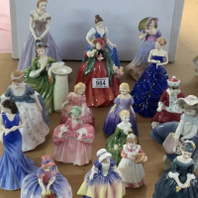 A large collection of porcelain and girl lady figurines to include Royal Doulton, Lladro, Royal Worcester, Adderley.