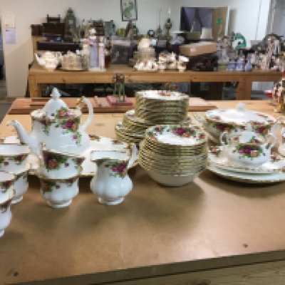 A Royal Albert Country Roses tea set including cups, saucers, tea pot, plates etc