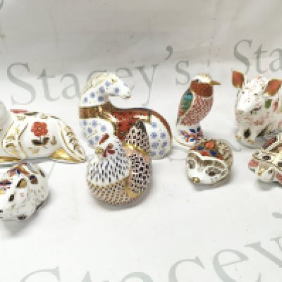 A collection of Royal Crown Derby paperweights , some with gold stoppers. This lot cannot be posted