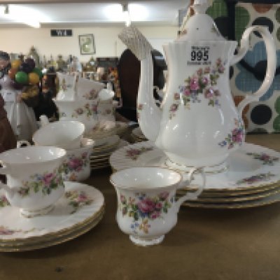 A Royal Albert Moss Rose coffee set decorated with flowers and flowers.