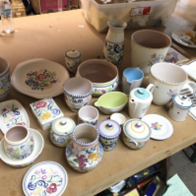 A collection of poole pottery including vases, dishes, containers, three cities in sketch plates etc
