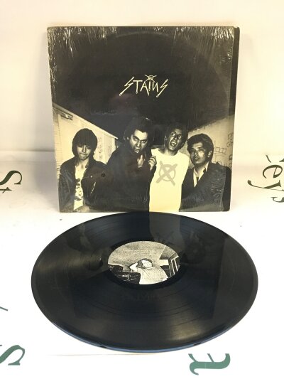 A 1987 repressing of the The Stains self titled LP. Vinyl EX.