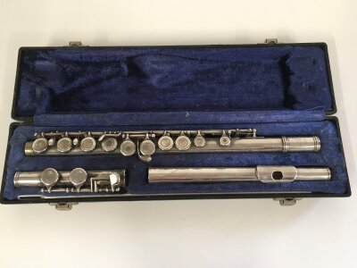A cased Emerson silver flute.