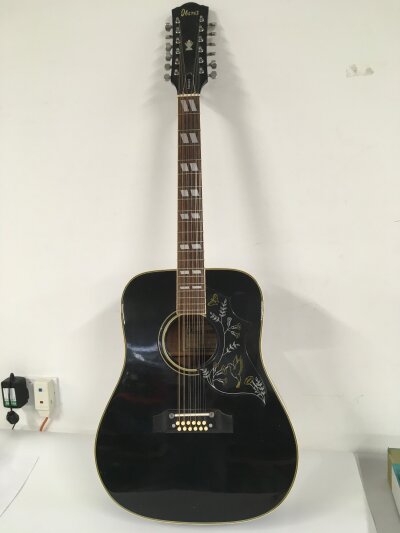 An Ibanez E684 12 string acoustic guitar and stand (2). No case.