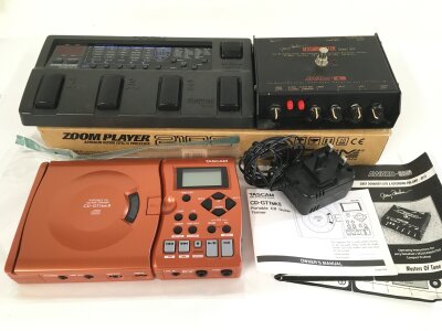 A Jerry Donahue Session Master guitar emulator pre amp pedal with instructions, a boxed Zoom 2100 guitar effects processor and a Tascam CD-GTMKII portable CD guitar trainer with power lead and instructions (3).