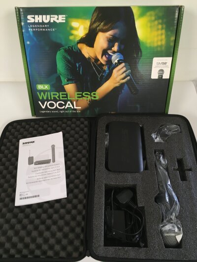 A boxed Shure BLX Wireless Vocal microphone system. Includes a Shure SM58 wireless microphone.