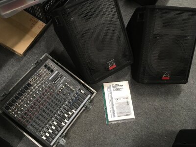 A PA system comprising a Mackie CFX12 mixer in flight case, a pair of Mackie MK1 speakers and a pair of Wharfedale Pro wedge monitors. Comes with manuals and some leads.
