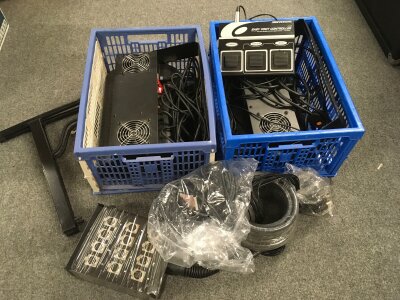 Two boxes of disco lighting, Gator flight case and a collection of music and mic stands.