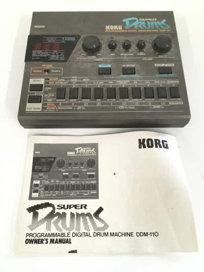 A Korg Super Drums DDM-110 drum machine. Comes with manual.