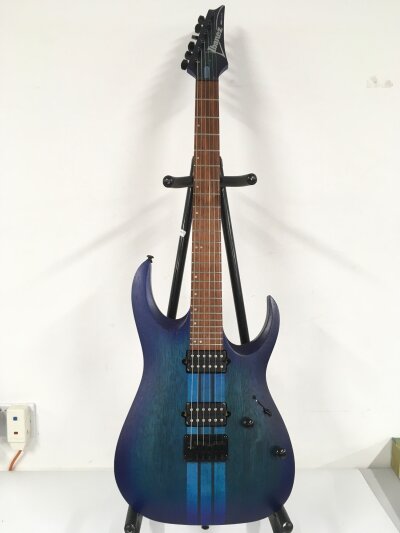 An Ibanez RG Series electric guitar. Comes with soft carry case.