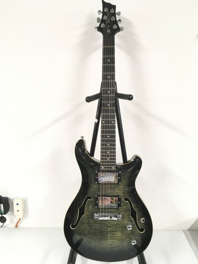 A Harley Benton CST 24 Deluxe electric guitar. Comes with soft carry case.