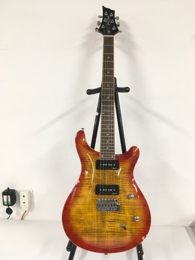 Two Harley Benton electric guitars comprising a C-24 Deluxe model and one other with a repaired neck. Both with soft carry cases.