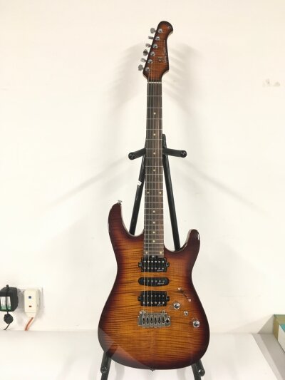 A Harley Benton electric guitar. Comes with soft carry case.