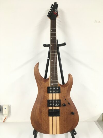 A Cort XTHT-2 electric guitar. Comes with soft carry case.