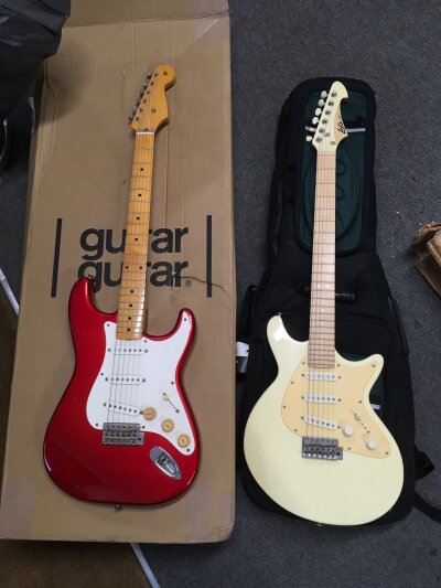 Two electric guitars comprising a LAG example with soft carry case and one other unnamed Start style guitar with retail box (2).
