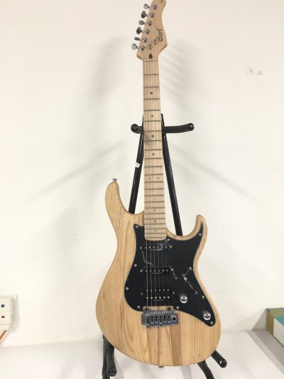 A Cort G260 Strat style electric guitar. Comes with soft carry case.