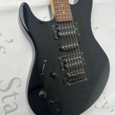 A Yamaha RGX 121 left handed electric guitar in black with black chrome parts. Good overall condition with some playwear and marks to back. No case.