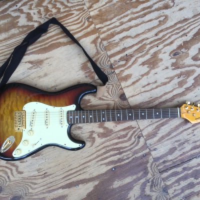 A Musical Tools Stratocaster style electric guitar. Comes with a soft carry case.