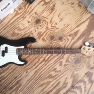 A Boston Precision style bass guitar and a hand built cigar box bass guitar (2). No cases.