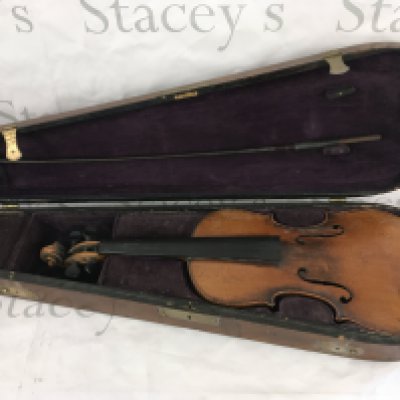 A cased violin marked Stradivarius.