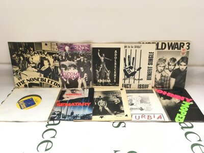 Ten punk 7" singles by various artists including The Nosebleeds, Adolescents, Buzzcocks and others.