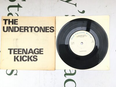 The Undertones - Teenage Kicks. A first UK pressing of this seminal 7" EP with wraparound poster sleeve and solid centre. Vinyl EX.