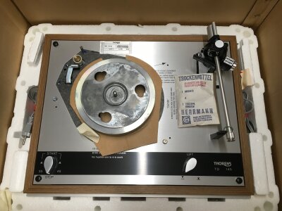A Thorens TD145 turntable with original packaging and retail box. No platter.