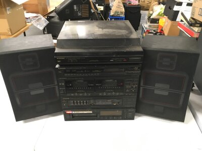 A Pioneer hi fi system comprising a PL-X77Z record player, CD, cassette etc plus a pair of Amstrad speakers.