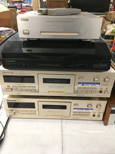 A collection of HiFi equipment comprising a Denon POA F100 triple power amp, a vintage Akai GXC 46D Dolby cassette player, two Pioneer T-D7 cassette decks with remotes etc.