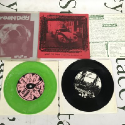 Two early Green Day EPs comprising a green vinyl pressing of the Slappy EP and a limited edition reissue of Sweet Children complete with insert. 