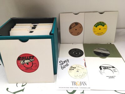 A record case of thirty collectable reggae and ska 7" singles, various labels including Bullet, Grape, Ska Beat and others.