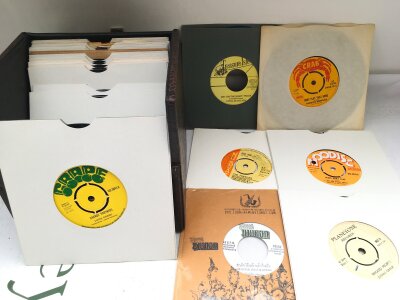 A record case of thirty collectable reggae and ska 7" singles, various labels including Crab, Treasure Isle, Nu Beat, Grape, Gas, Giant and others. Some rare.
