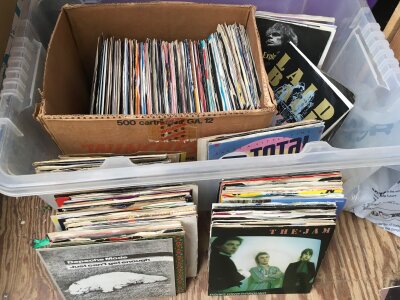 Two boxes of 7" and 12" singles and LPs by various artists including The Jam, Depeche Mode, Kraftwerk and many more.