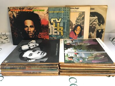 A collection of LPs by various artists including The Byrds, Bob Marley, Miles Davis and others.