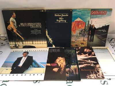 Two bags containing 18 rock LPs by various artists including Bruce Springsteen, Steve Winwood, Little Feat and others.