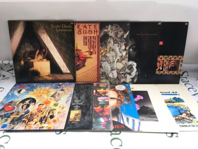 Two bags containing 23 rock & pop LPs and 12" singles from the 1980s by various artists including Kate Bush, Level 42, Genesis and others.
