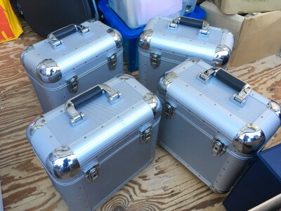 Four heavy duty aluminium record cases.
