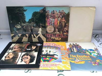 Six Beatles LPs comprising early UK pressings of Abbey Road, Sgt Pepper, Yellow Submarine and others.
