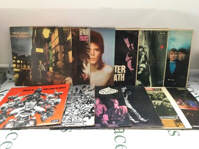 Twelve LPs by various artists including David Bowie, The Rolling Stones, Cream and John Mayall.